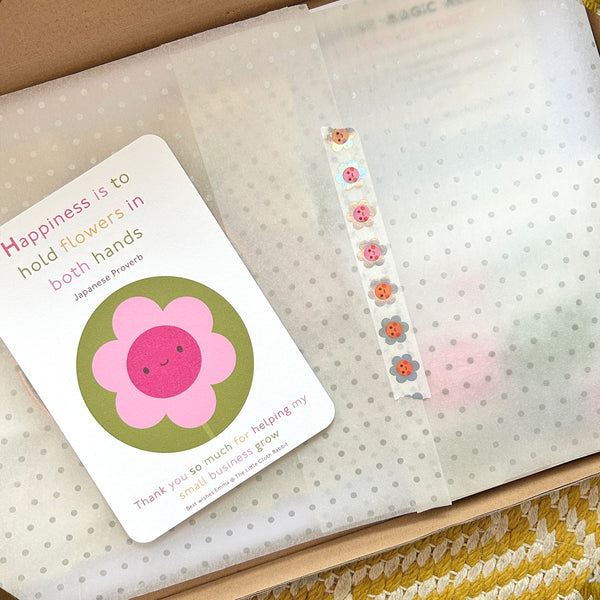 Close-up of Happiness thank-you card with holographic flower washi tape